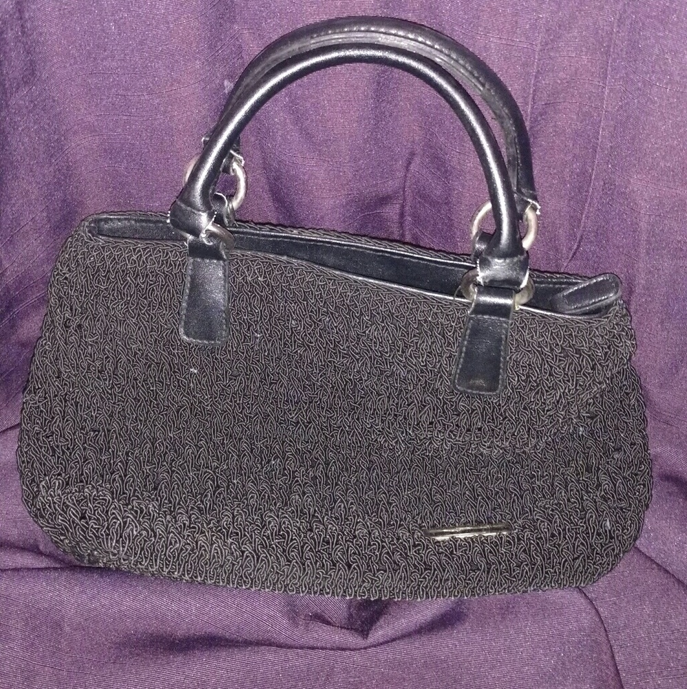 Black material inexpensive purse very clean.