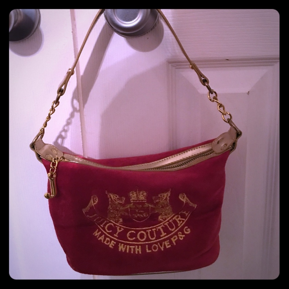 Juicy couture red velour bag with gold trim.