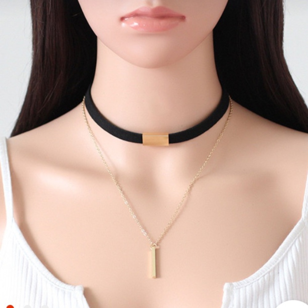 Black velvet choker necklace with gold.