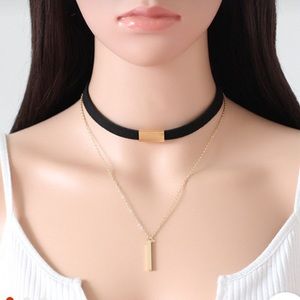 Black velvet choker necklace with gold.