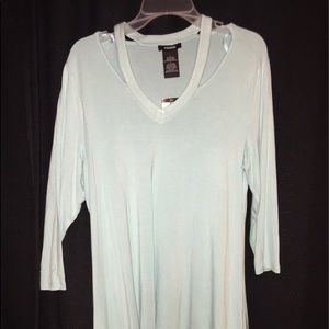 turquoise shirt with collar bone cutouts