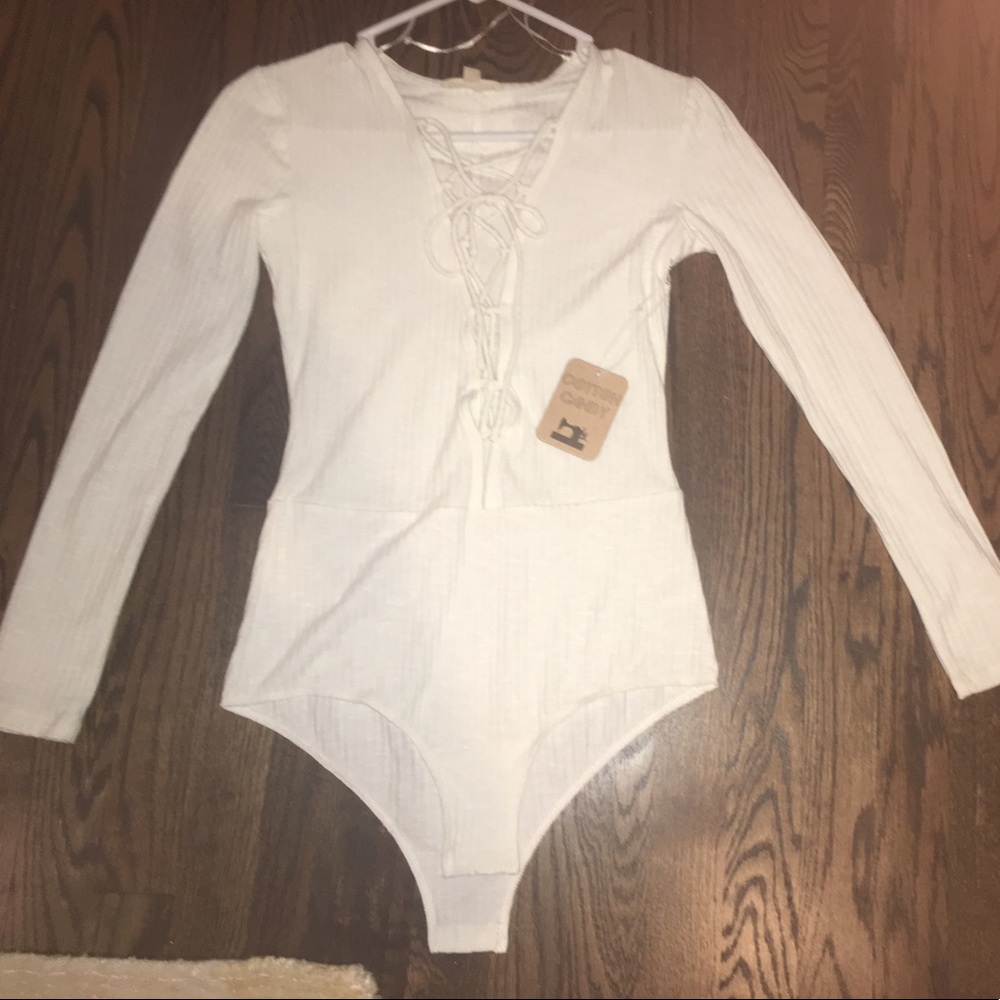 BRAND. NEW NEVER WORN LACE UP FRONT BODYSUIT
