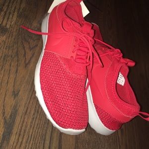 Red Nike tennis shoes