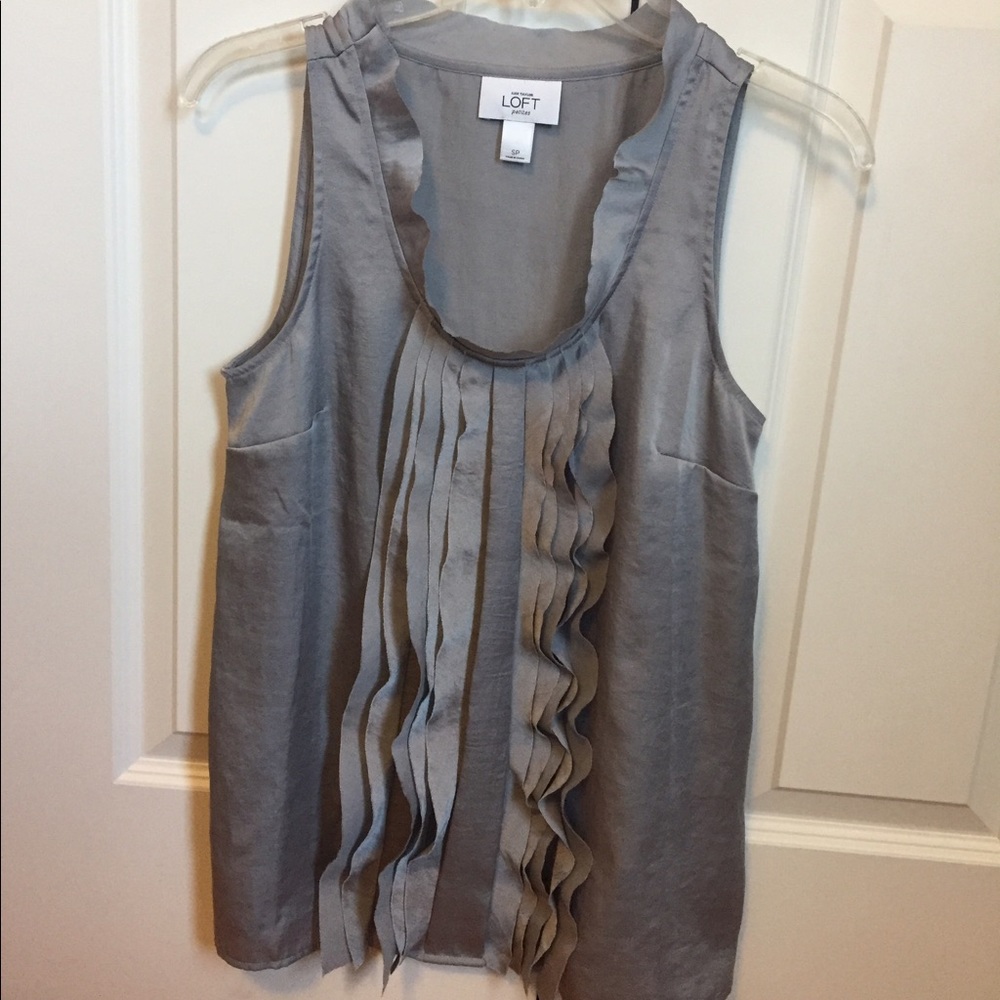 Adorable silk sleeveless blouse.