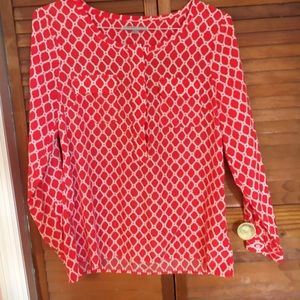Selling a red long sleeve shirt for women to wear