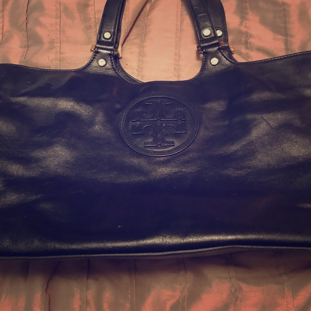 Tory burch bag in fair condition had a ink marks