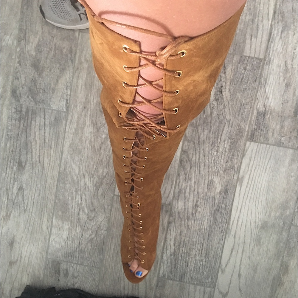 Thigh high lace up boots
