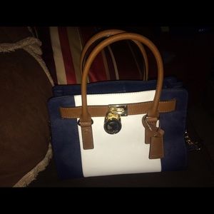 Michael Kors Navy, White, and brown purse.
