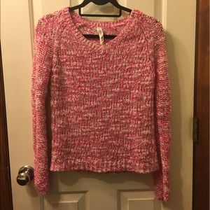 Soft knitted pink and white sweater.