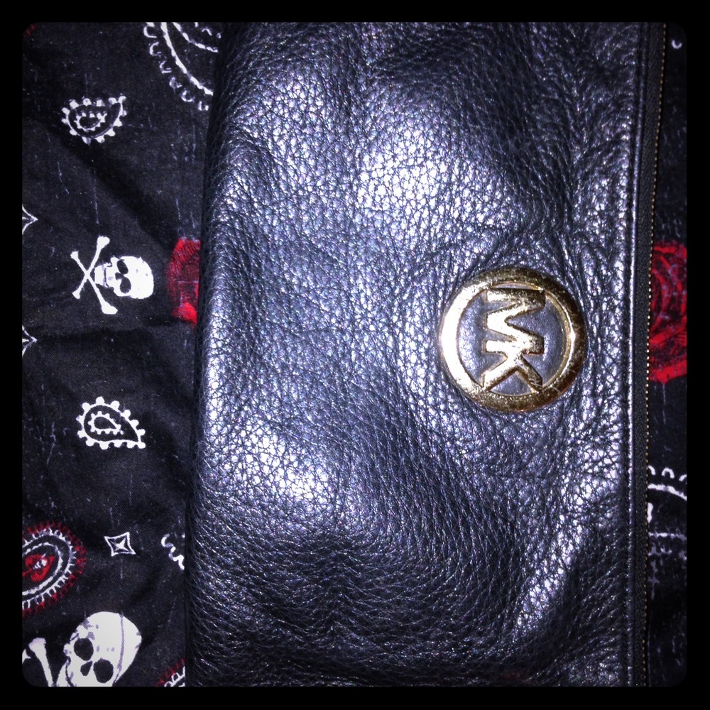 Used M.K clutch. Solid black