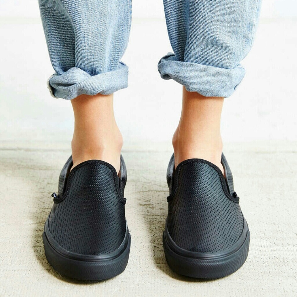 Vans perforated black leather slip ons