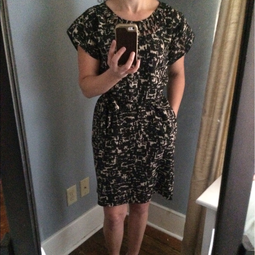 Lined shift dress with cutouts and pockets