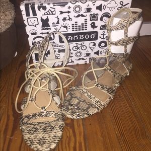 Lace up snake print sandals