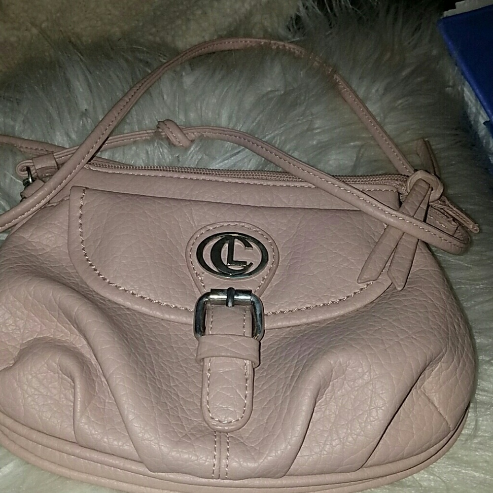 A small round pastel pink color bag