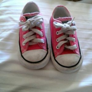 Dark pink converse tennis shoes