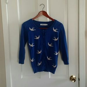 Blue cardigan with white bird pattern