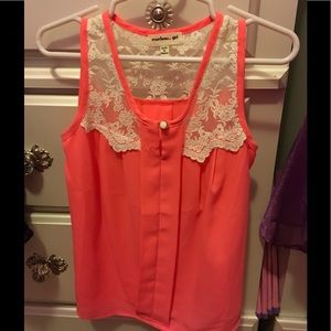 Bright orange blouse with white lace