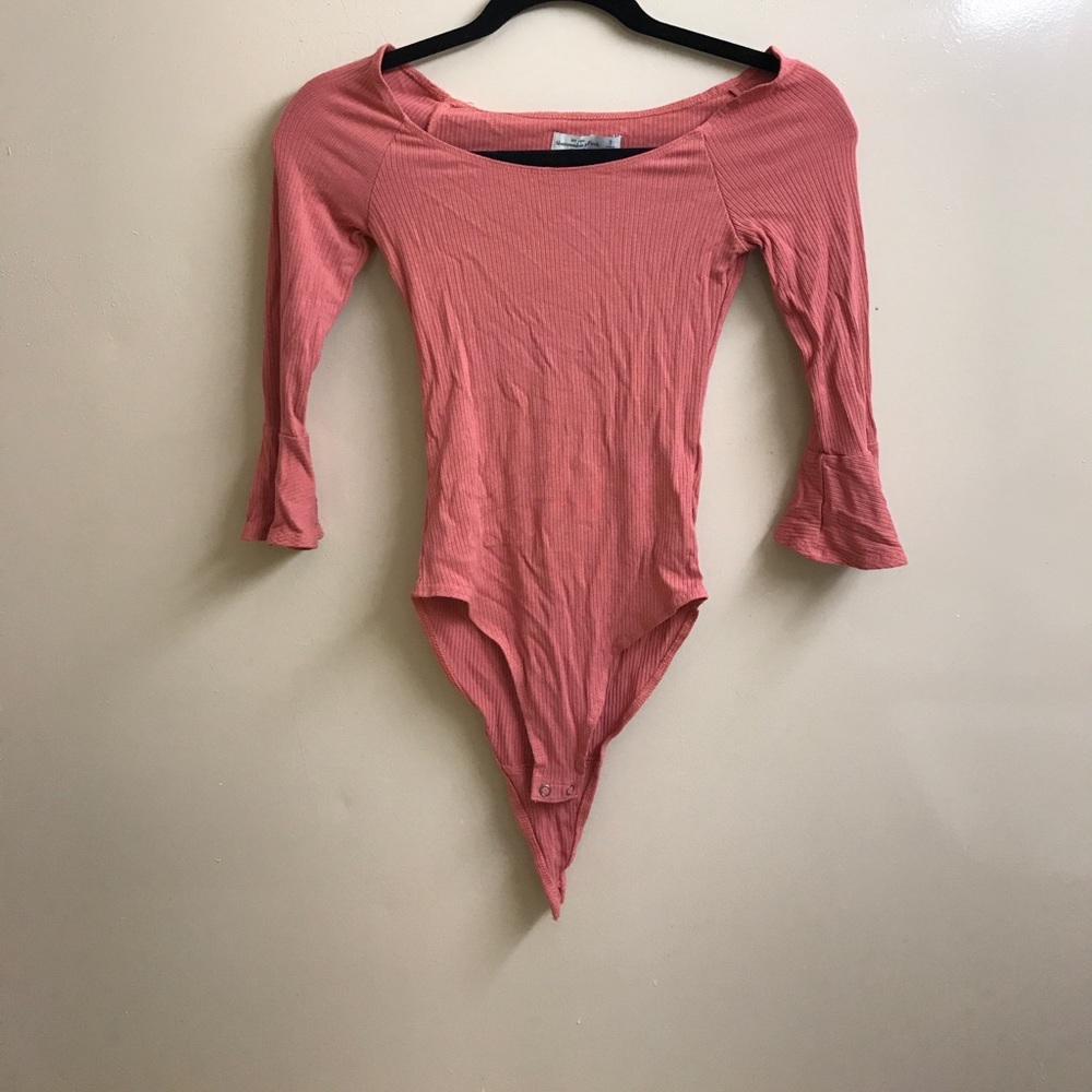 Pink off the shoulder body suit