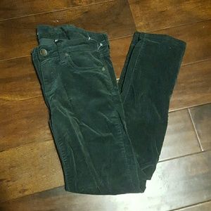 Dark green corduroy pants.