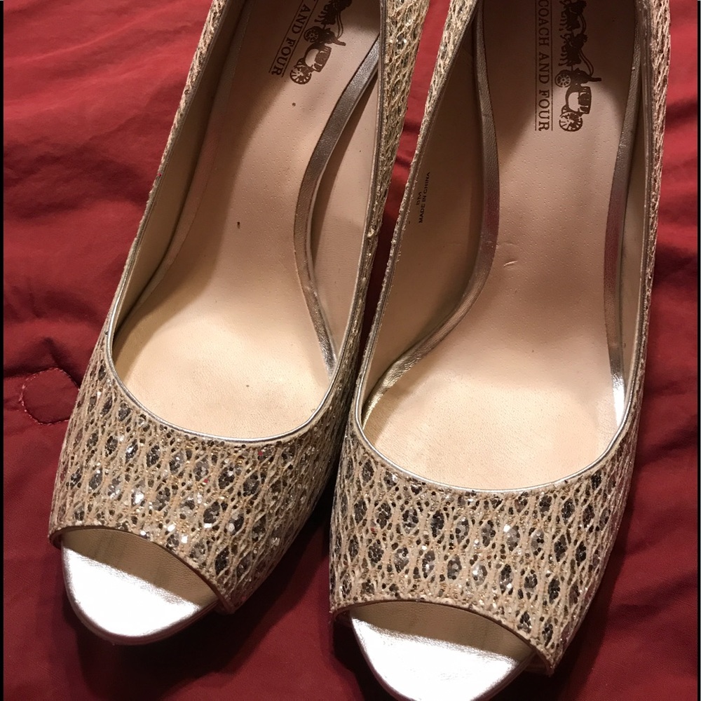 Ladies size 8 Coach heels in shimmery silver.