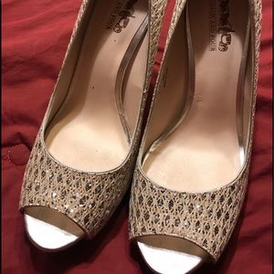 Ladies size 8 Coach heels in shimmery silver.