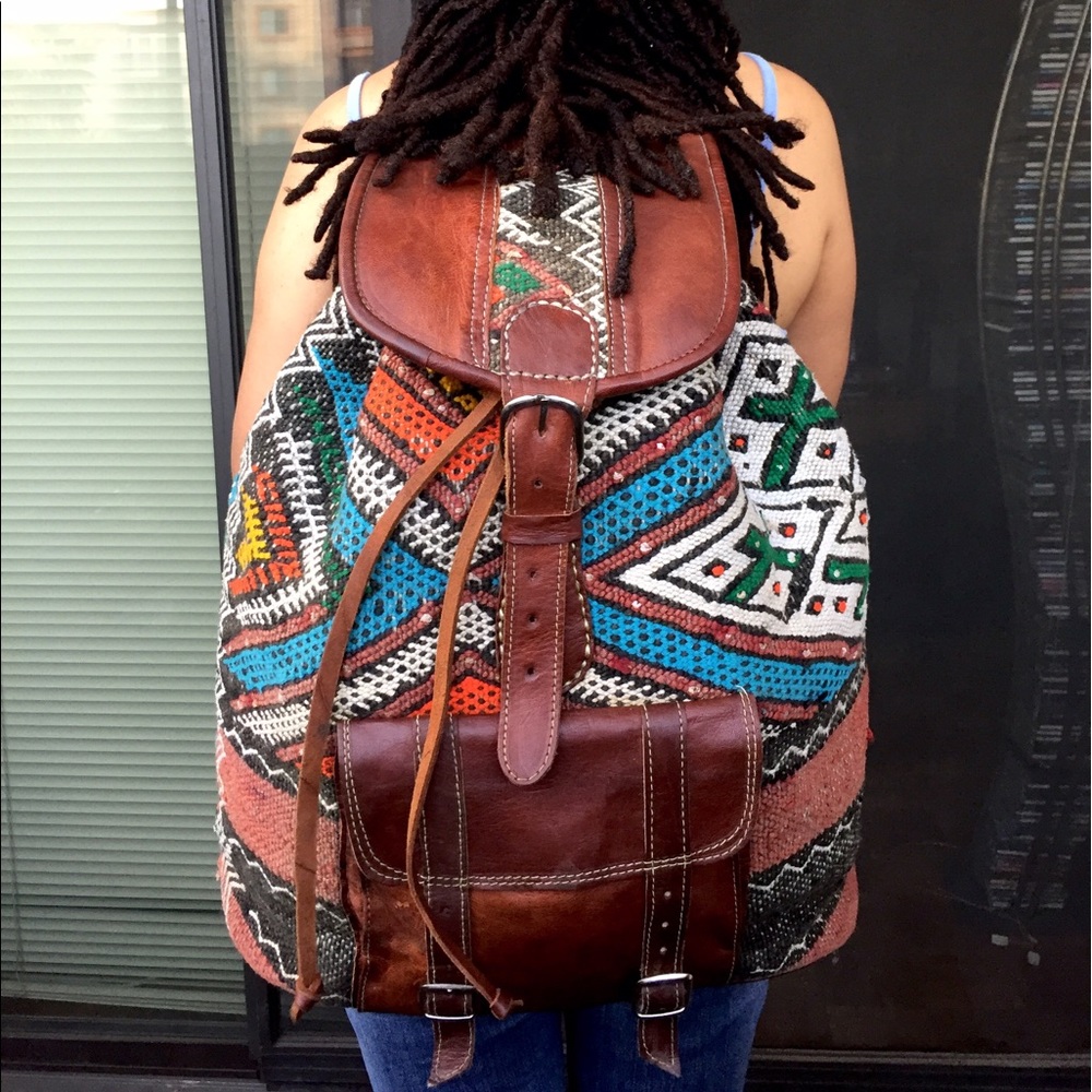 Large size leather back pack with vintage carpet.
