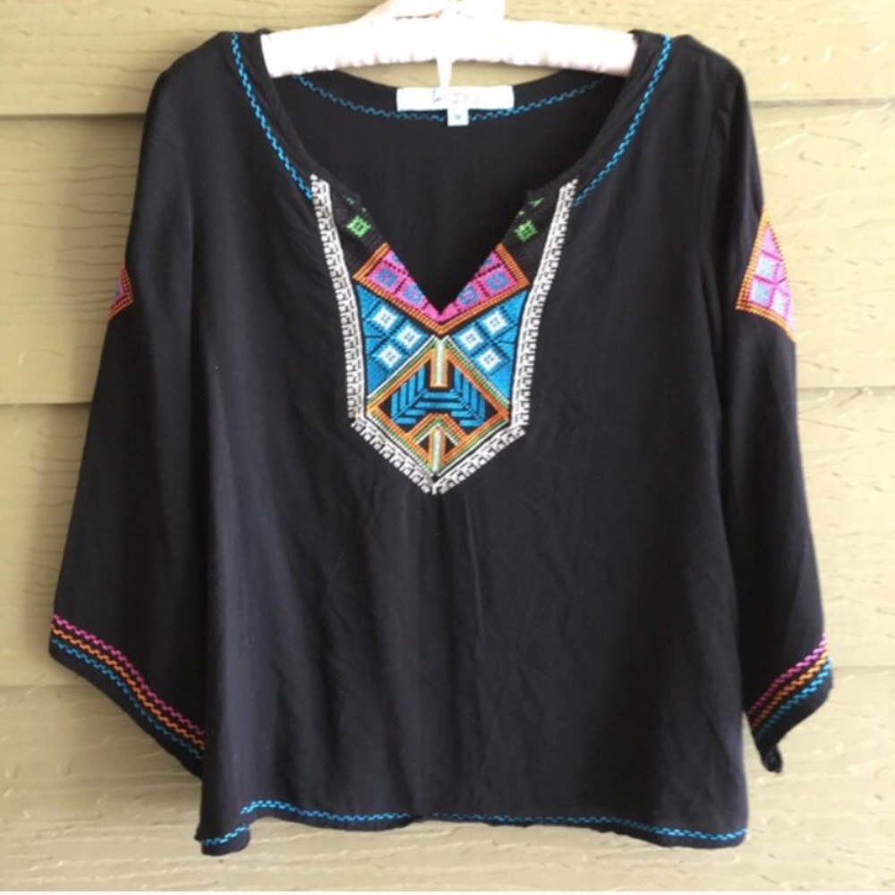 Black blouse with 3/4 sleeves that flare out