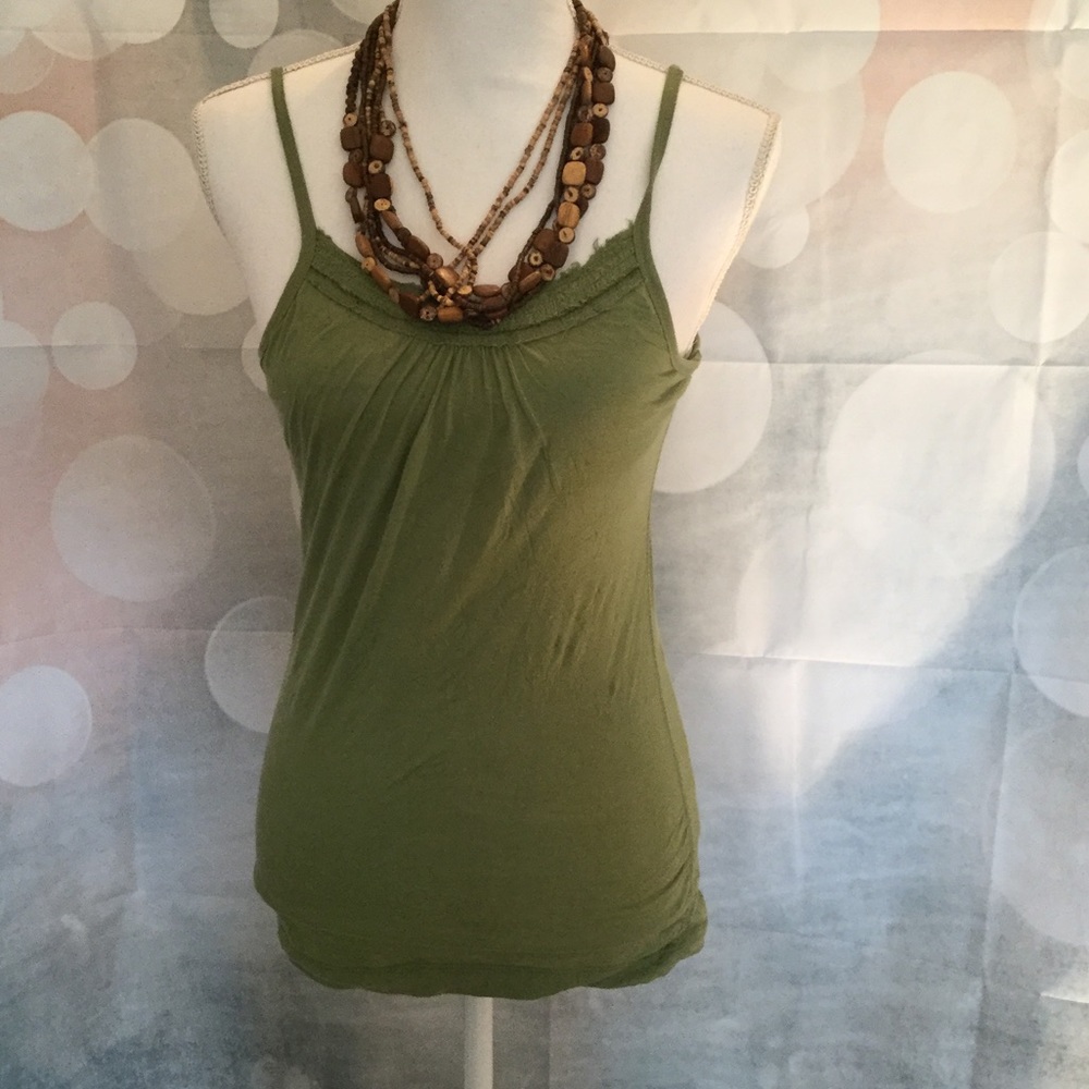 Green tank top with detailing at neck line