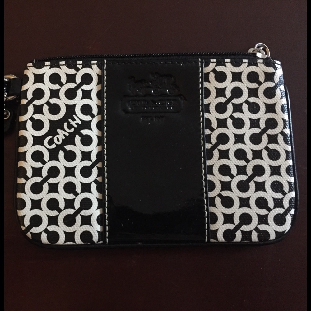 Coach. Black and White Wristlets.