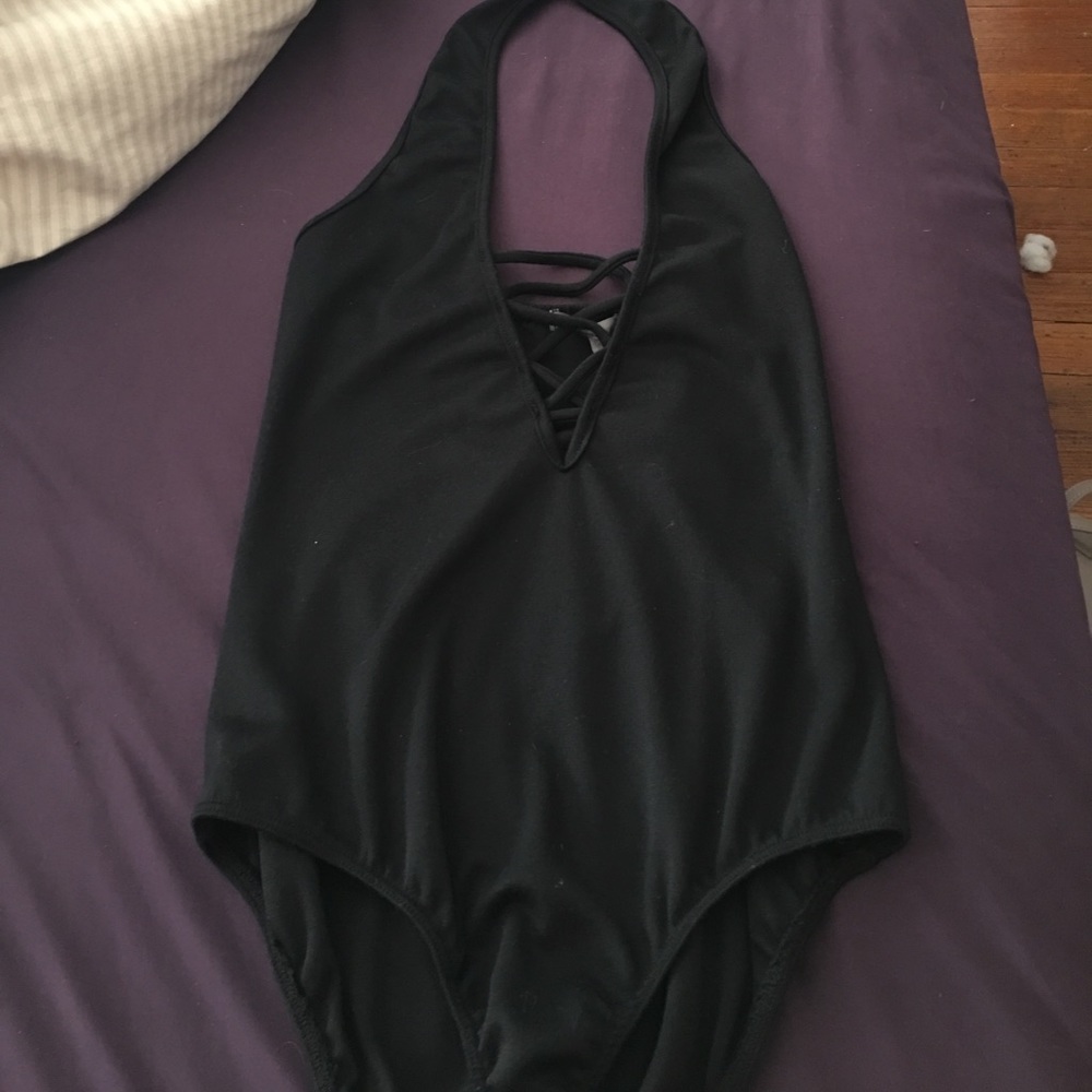 Black body suit with a cris cross middle