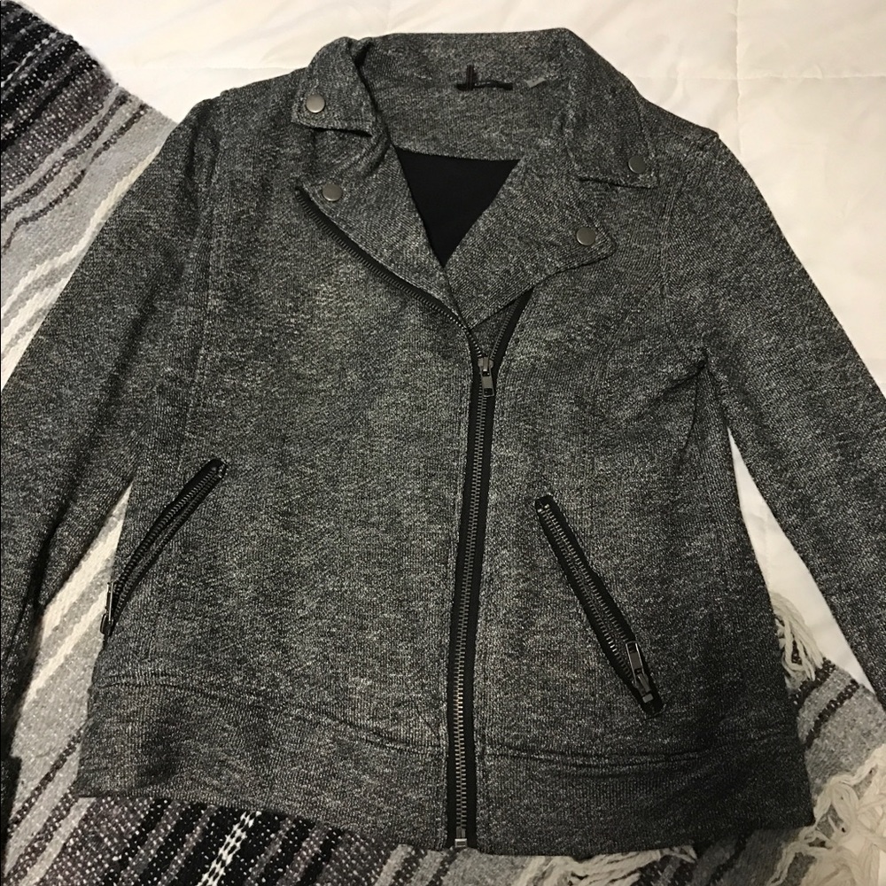 Sweatshirt material jacket with asymmetrical zip