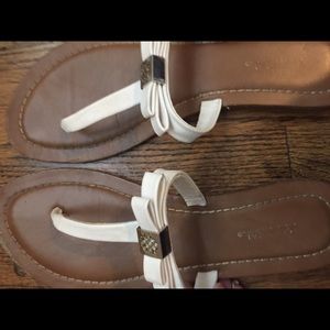 white designer flip flops