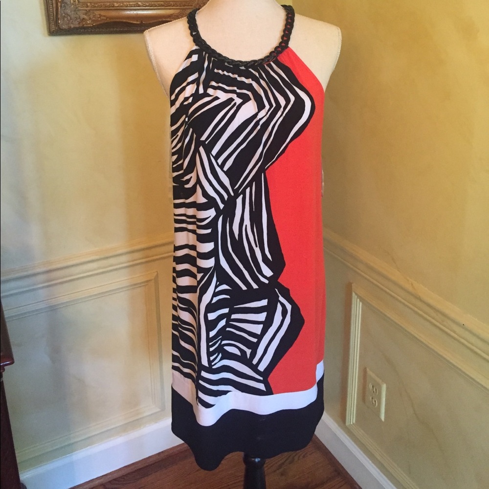 Dress with black chain around neck