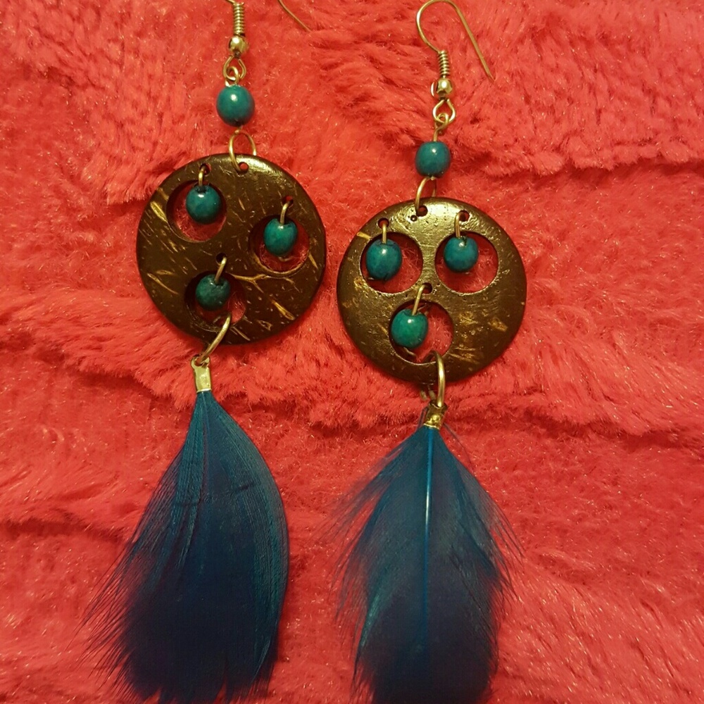 Brand new blue feather earrings