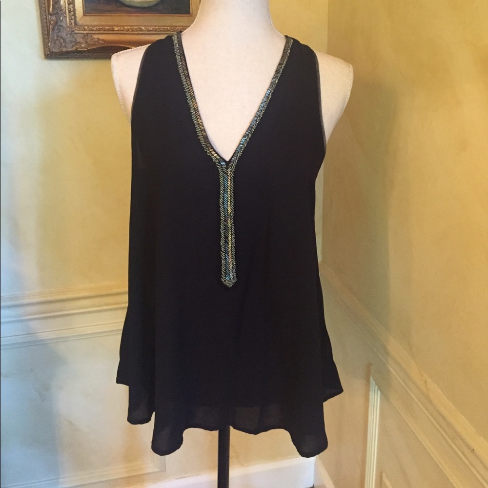 Black. Cut in sleeveless cotton top with v neck