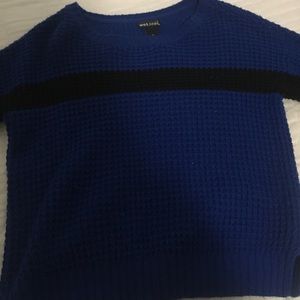 blue slightly cropped sweater with black stripe
