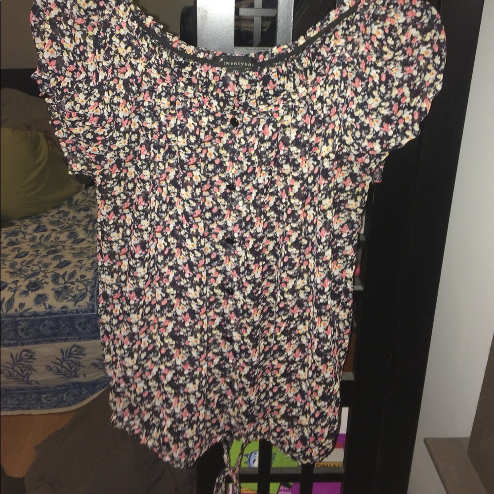 Sheer floral top with elastic sleeve and neck.