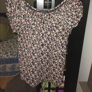 Sheer floral top with elastic sleeve and neck.