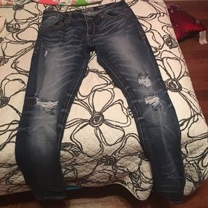 Buckle black skinny jeans