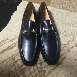 Size 12 navy blue Gucci loafers.
