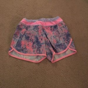 purple and pink ivivva running shorts
