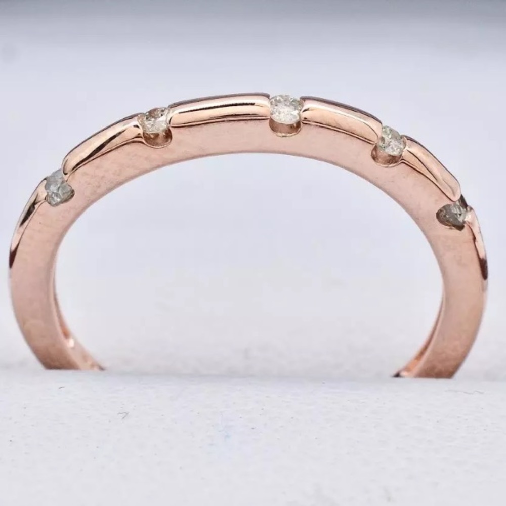 Stunning 14k rose gold band with genuine diamonds
