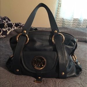 Blue Micheal Kors medium size purse.
