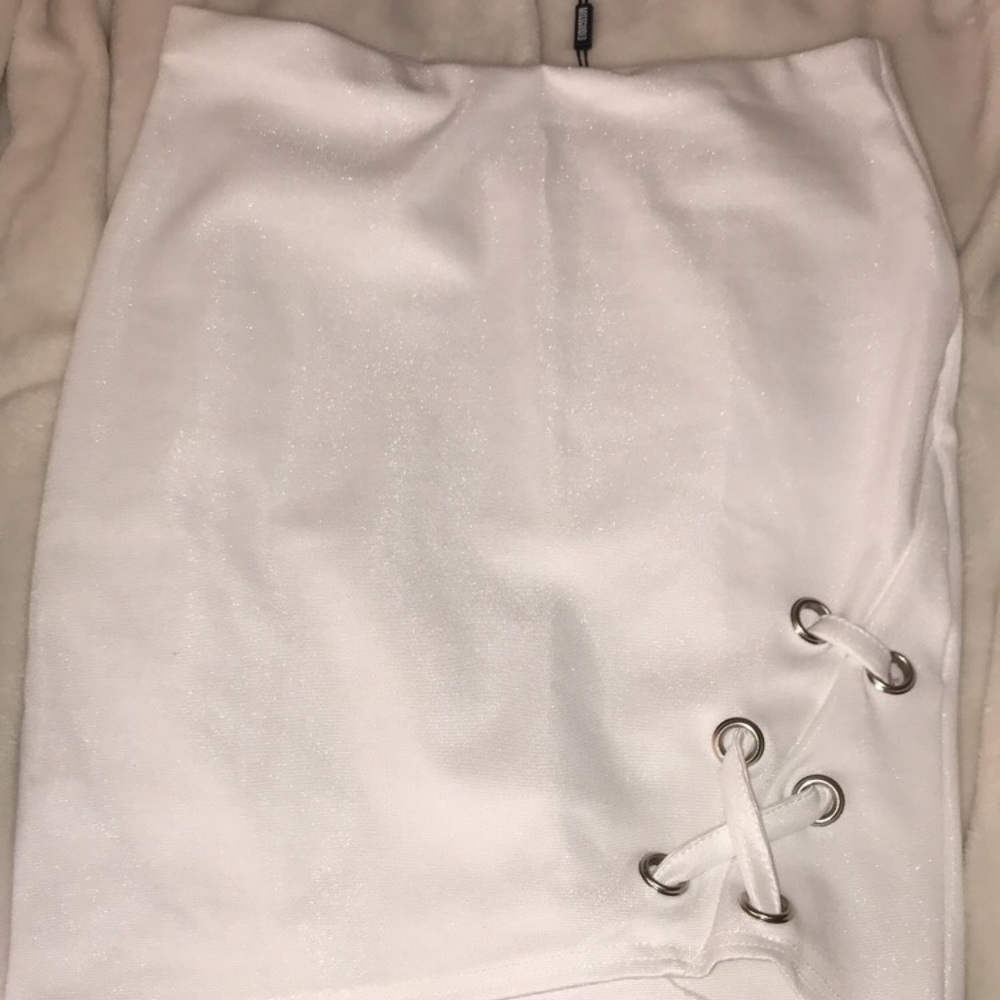 white fitted skirt with lace up detail
