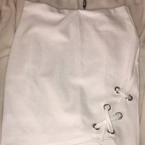 white fitted skirt with lace up detail