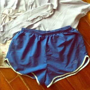 Adidas blue running shorts with back zipper pocket