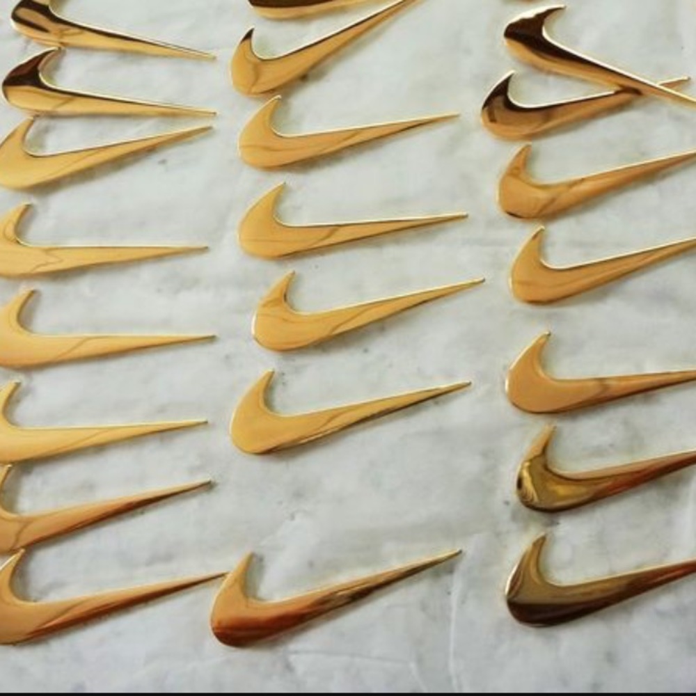 Gold Nike pins