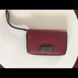 Marc Jacobs maroon wallet.