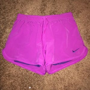 Pink and purple Nike shorts w/ spandex underneath