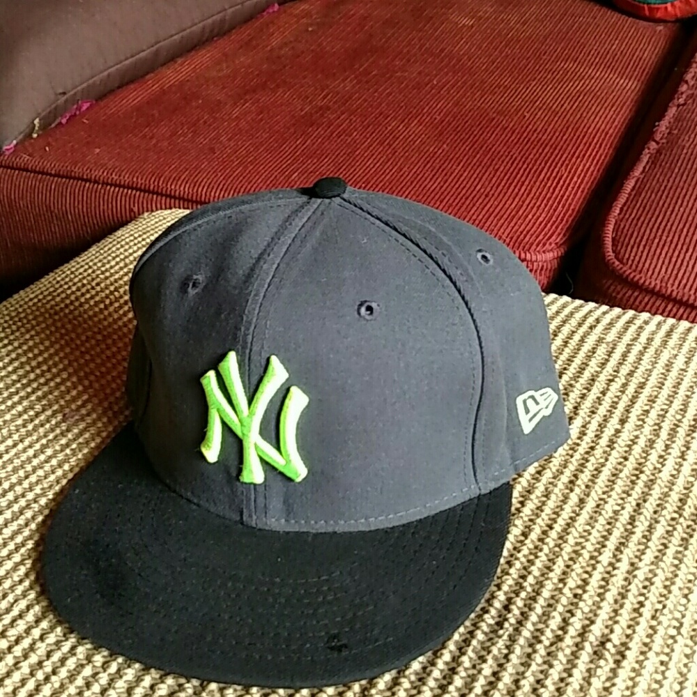 A lime green and grey New Era Yankee's fitted